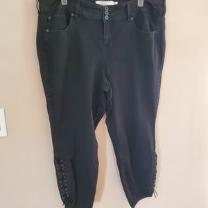 Torrid black jegging jeans with lace up detail.